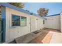 Exterior view showcasing a white trimmed patio entry and brickwork at 4032 Great Plains Way, Las Vegas, NV 89121