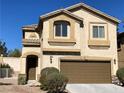 Two-story home with a two-car garage and neutral stucco exterior, under a clear blue sky at 405 Center Green Dr, Las Vegas, NV 89148