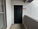 Exterior of front door with apartment number and concrete patio at 45 Maleena Mesa St # 1921, Henderson, NV 89074