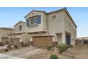 Charming home featuring a two-car garage, brick driveway, stylish shutters, and xeriscaping at 4727 Agave Cactus St, North Las Vegas, NV 89031