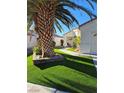 Charming single-story home featuring terracotta roof and inviting desert landscaping with artificial turf at 6705 Old Newbury Ave, Las Vegas, NV 89108
