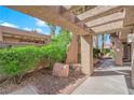 Charming courtyard with lush greenery and shade, inviting outdoor relaxation at 7368 Mission Hills Dr, Las Vegas, NV 89113