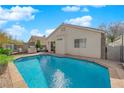 Backyard featuring a refreshing in-ground pool, ideal for outdoor entertaining and relaxation at 8468 W Gilmore Ave, Las Vegas, NV 89129