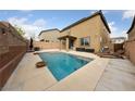 Spacious backyard featuring a sparkling pool, lounge chairs, and tasteful landscaping at 10373 Northern Hills Ave, Las Vegas, NV 89166