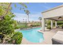 Resort-style pool and patio area with golf course views, ideal for entertaining and enjoying outdoor living at 181 Cliff Valley Dr, Las Vegas, NV 89148