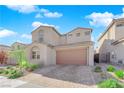 Charming two-story home with neutral stucco, brown garage door, stone driveway, and manicured front yard at 227 Badwater Basin St, Las Vegas, NV 89138