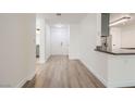 Bright interior hallway with wood floors and neutral paint at 2325 Windmill Pkwy # 811, Henderson, NV 89074