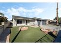 Beautiful single-story home with manicured lawn, charming garden beds, and a freshly painted exterior at 2549 Pine Creek Rd, Las Vegas, NV 89115