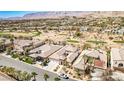 Expansive aerial view showcasing the desert community, golf course, and the home's prime location at 3163 Elk Clover St, Las Vegas, NV 89135