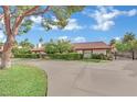 Charming home featuring mature trees and a spacious circular driveway at 3221 Montecito Dr, Las Vegas, NV 89120