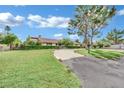 Beautiful home featuring mature trees and lush green lawn at 3221 Montecito Dr, Las Vegas, NV 89120