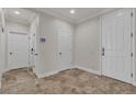 Inviting foyer boasting tile flooring, neutral paint, and two hallway closets at 3685 Australian Cloud Dr, Las Vegas, NV 89135
