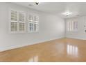 Bright, open living area with shuttered windows and unique flooring at 4036 W Bird Man Ln, North Las Vegas, NV 89084