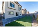 Backyard featuring a patio area and artificial turf at 480 Silverweed Ave, Henderson, NV 89044