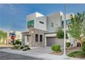 Contemporary two-story home featuring a stylish facade and a paved driveway at 513 Founders Creek Ave, North Las Vegas, NV 89084