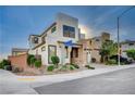 Contemporary two-story home featuring a stylish facade and professional landscaping at 513 Founders Creek Ave, North Las Vegas, NV 89084