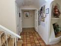 Hallway featuring tiled floors that lead to a bright living space at 5820 W Desert Inn Rd, Las Vegas, NV 89146
