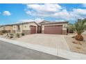 Charming single story home featuring a two-car garage, desert landscaping, and stunning desert climate architecture at 6217 Starflare St, Las Vegas, NV 89148