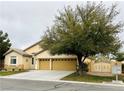 Charming single-story home with a three-car garage and a well-manicured front lawn at 7172 Painted Paradise St, Las Vegas, NV 89131