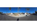 Wide street view of homes with desert landscaping in a suburban neighborhood at 824 Holly Lake Way, Henderson, NV 89002