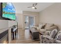 Bright living room featuring modern furniture, flooring, and fireplace at 9050 W Warm Springs Rd # 1093, Las Vegas, NV 89148
