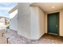 Inviting front door with brick pathway and well-maintained exterior at 9380 Lunar Effect St, Las Vegas, NV 89143
