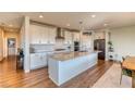 Spacious kitchen with white cabinets, stainless appliances, and a large island at 9380 Lunar Effect St, Las Vegas, NV 89143