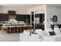 Modern kitchen featuring a large island, stainless appliances, and stylish cabinetry at 10921 Rossa Peak Ave, Las Vegas, NV 89135