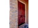 Elegant wood front door with decorative brickwork and a welcoming entrance at 1125 Via Canale Dr, Henderson, NV 89011