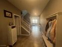 Inviting foyer with tile flooring leading to the staircase and living area at 2204 Valdina St, Henderson, NV 89044