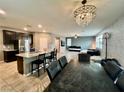 Open living room concept with kitchen and living area, great for entertaining at 2204 Valdina St, Henderson, NV 89044