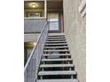 Exterior stairway leading to a condominium unit with a covered entryway at 2300 E Silverado Ranch Blvd # 2074, Las Vegas, NV 89183