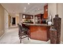Modern kitchen featuring a breakfast bar, stainless steel appliances, and elegant finishes at 2700 Las Vegas Blvd # 1002, Las Vegas, NV 89109