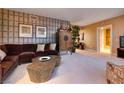 Comfortable living room featuring unique coffee table, stylish decor and natural light at 2700 Las Vegas Blvd # 1002, Las Vegas, NV 89109