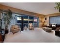 Beautiful living room with floor to ceiling windows overlooking a magnificent sunset and city view at 2700 Las Vegas Blvd # 1002, Las Vegas, NV 89109