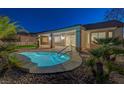 Backyard pool with spa, desert landscaping and covered patio for outdoor entertaining at 2820 Thunder Bay Ave, Henderson, NV 89052