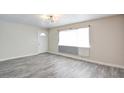 Bright living room with modern flooring and a large window offering plenty of natural light at 3247 Greenbriar Dr, Las Vegas, NV 89121