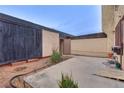 Spacious backyard area with concrete patio, mature landscaping, and privacy fence at 3301 China Dr, Las Vegas, NV 89121