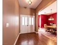 Spacious foyer showcasing wood floors and an adjacent dining area with elegant furnishings at 3684 Miguels Ln, Las Vegas, NV 89120