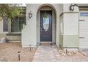 Close-up of the front door, brick-paver walkway, and landscaped yard at 3721 Moonshine Falls Ave, North Las Vegas, NV 89085