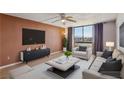 Bright living room with modern furniture, neutral tones, and large windows for ample light at 3930 University Center Dr # 804, Las Vegas, NV 89119