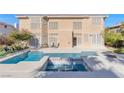 Outdoor oasis with a sparkling pool, spa, and patio area perfect for entertaining at 4024 Mansion Hall Ct, Las Vegas, NV 89129