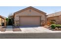 Charming single Gathering home showcasing a two-car garage with a neutral color palette at 4125 Gliding Gulls Ave, North Las Vegas, NV 89084