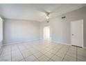 Spacious living room with tile flooring, ceiling fan, and neutral paint at 4495 Park View Dr, Las Vegas, NV 89104