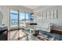 Bright living room featuring modern decor, a comfortable white sofa, and expansive windows with city views at 4525 Dean Martin Dr # 2001, Las Vegas, NV 89103