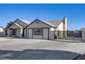 Single-story home with gated parking and a neutral color scheme at 4629 Cattleman Ave, North Las Vegas, NV 89031