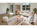 Bright living room featuring modern furniture, a large window, and tiled floors, virtually staged at 7255 W Sunset Rd # 1116, Las Vegas, NV 89113