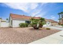 Well-maintained single-story house featuring desert landscaping and a classic tile roof at 7820 Wedlock Ln, Las Vegas, NV 89129
