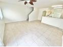 Open living space showcases tile floors and connects seamlessly to the kitchen area at 8748 Tomnitz Ave # 103, Las Vegas, NV 89178