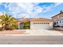 Charming home with a well-manicured lawn, tile roof, and two-car garage at 9564 Summer Cypress St, Las Vegas, NV 89123